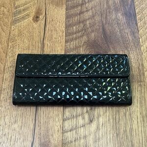 SFA Woman’s Black Leather Clutch